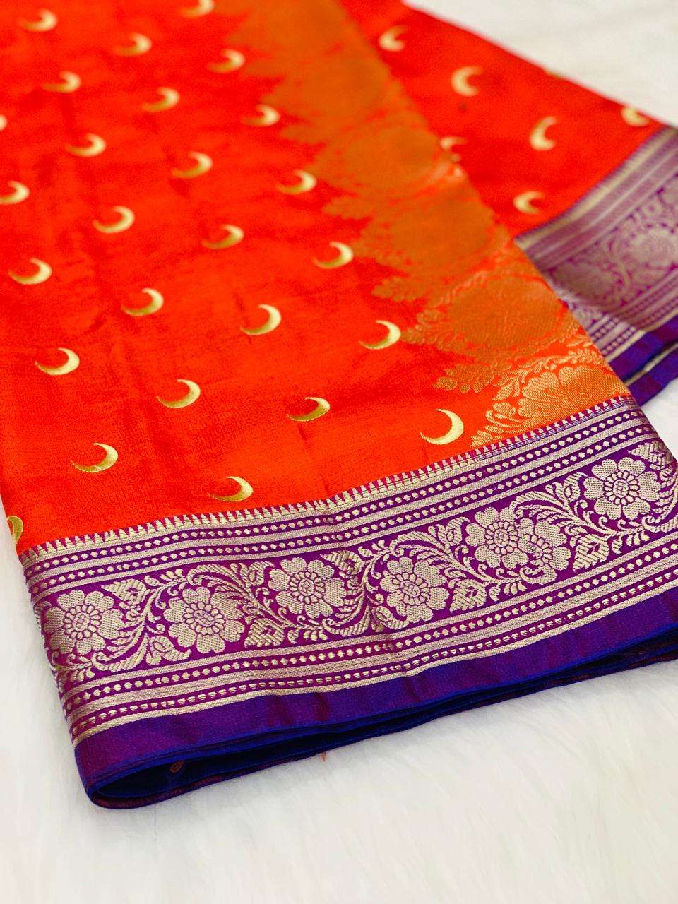 Radiant Orange Banarasi Silk Saree with Golden Moon Motifs & Purple Floral Zari Border